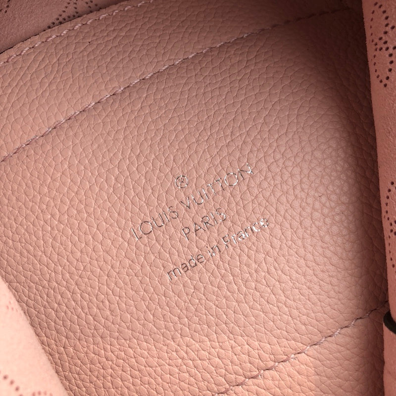 Back view of elevated signature women's handbag – women's statement bag