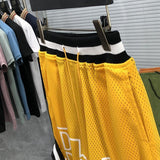 Front view of Rhude luxury clothing with streetwear-inspired cut