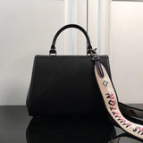 Side profile of sleek statement women's handbag – women's premium purse