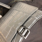 Handle and strap detail of premium signature women's handbag – women's statement bag