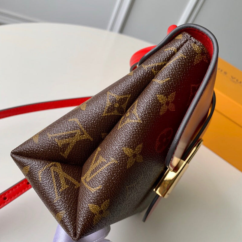Side profile of structured signature women's handbag – women's designer-style accessory