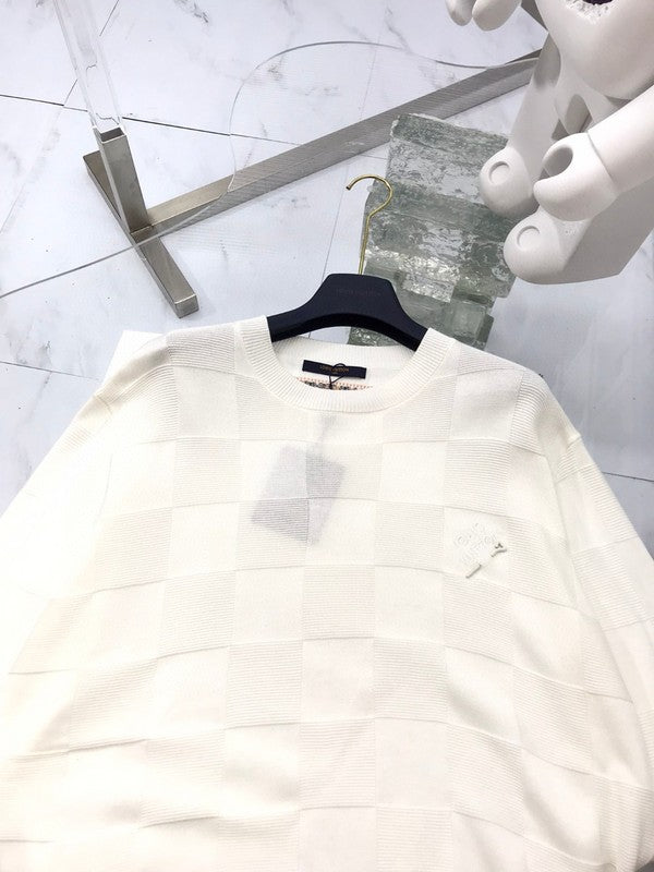 Front view of Louis Vuitton luxury clothing with signature branding