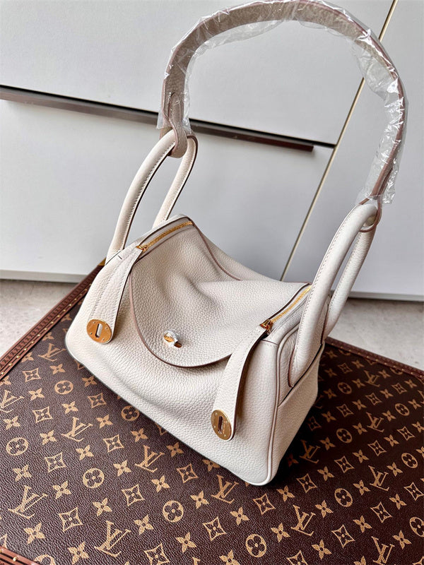  Timeless top-handle bag carried on shoulder 22