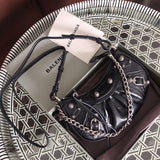 Side profile of everyday-luxe polished women's handbag – women's luxury accessory