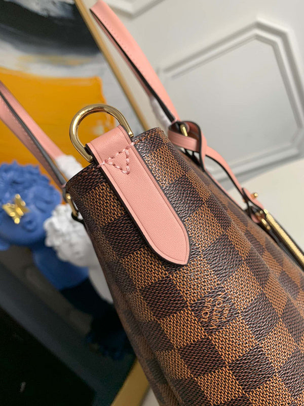 Styled lifestyle shot of classic signature women's handbag – women's luxury handbag