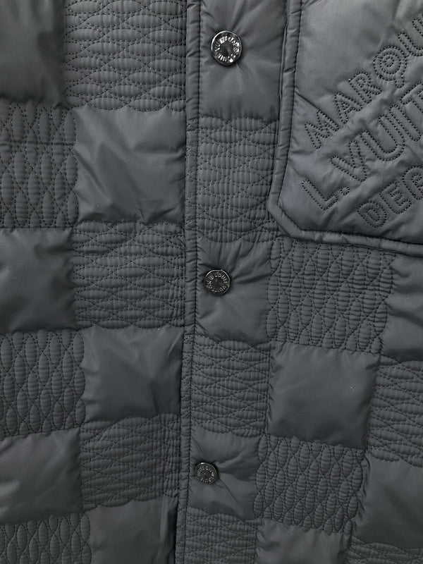 Flat lay presentation of Louis Vuitton luxury clothing with label-forward styling