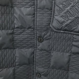 Flat lay presentation of Louis Vuitton luxury clothing with label-forward styling