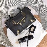 Side profile of structured premium women's handbag – women's luxury accessory