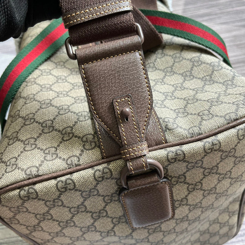 Handle and strap detail of classic signature women's handbag – women's statement bag