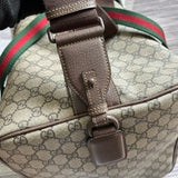 Handle and strap detail of classic signature women's handbag – women's statement bag