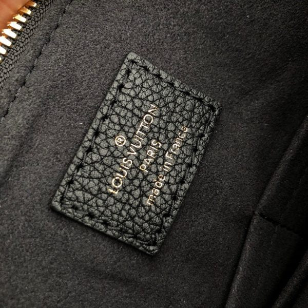 Handle and strap detail of modern statement women's handbag – women's designer-style accessory