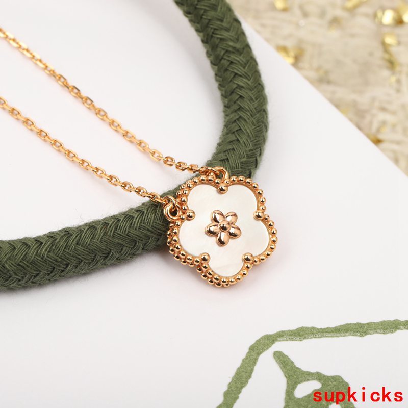 Lifestyle view of Van Cleef & Arpels unisex jewelry piece
