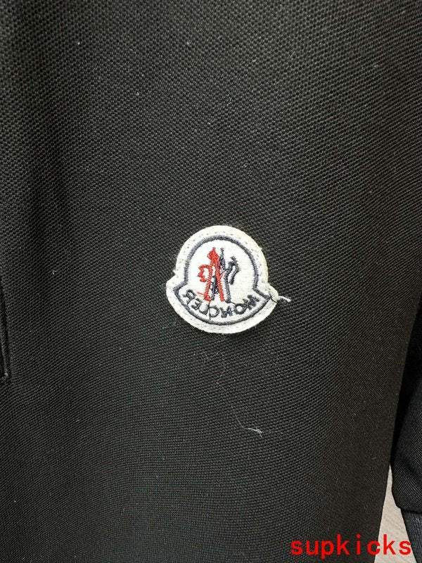 Flat lay presentation of Moncler luxury clothing with tailored silhouette