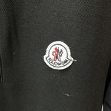 Flat lay presentation of Moncler luxury clothing with tailored silhouette