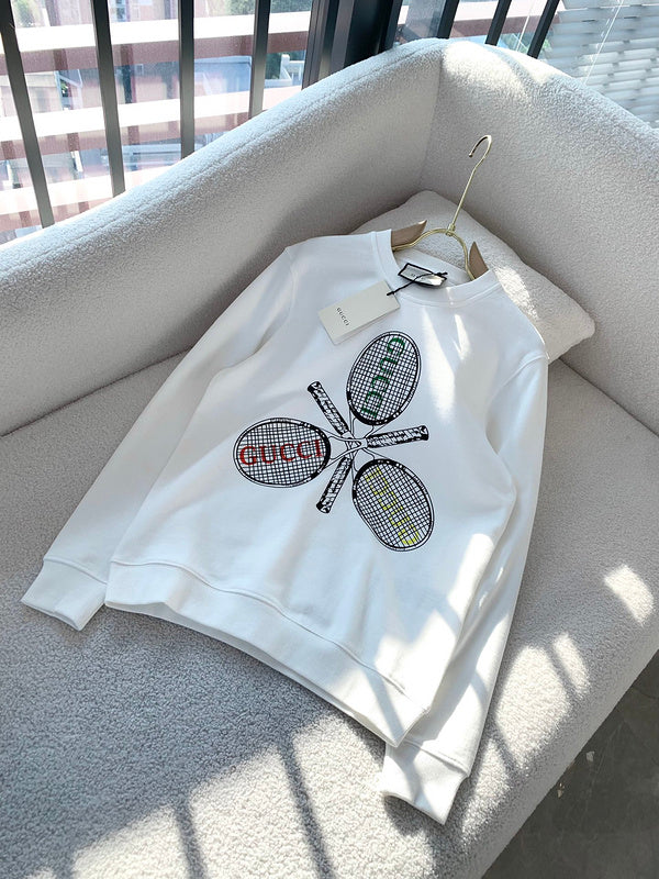 Flat lay presentation of Gucci luxury clothing with monogram-inspired silhouette