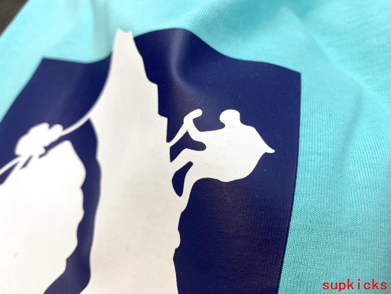 Side profile of Rhude luxury clothing with logo-detail design