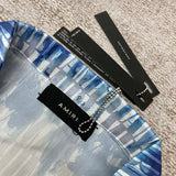 Three-quarter angle view of Amiri luxury piece style No.095