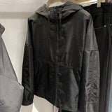 Close-up detail shot of Louis Vuitton luxury clothing with relaxed-fit cut