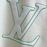 Flat lay presentation of Louis Vuitton luxury clothing with logo-detail design