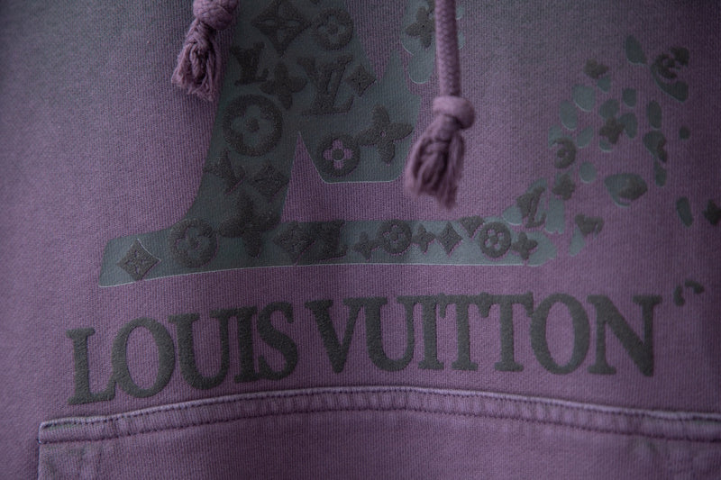 Flat lay presentation of Louis Vuitton luxury clothing with tailored silhouette