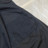 Close-up detail shot of Louis Vuitton luxury clothing with label-forward styling