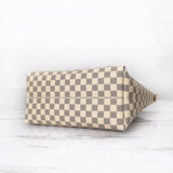 Styled lifestyle shot of signature polished women's handbag – women's everyday handbag
