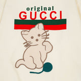 Flat lay presentation of Gucci luxury clothing with contemporary cut