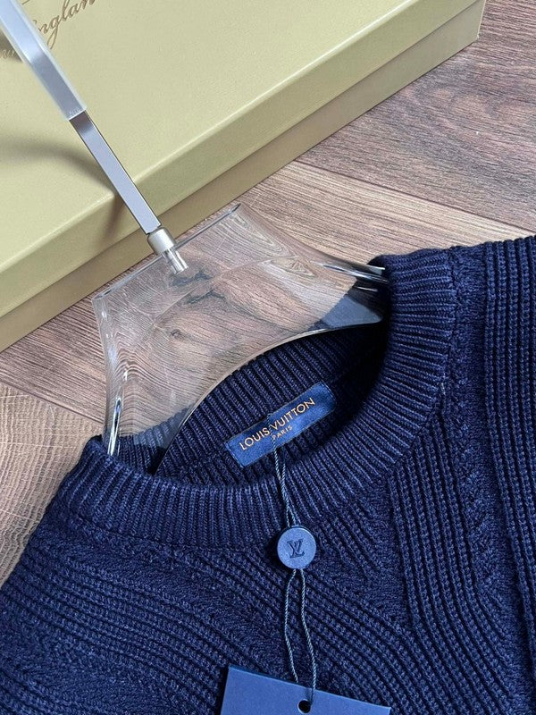 Close-up detail shot of Louis Vuitton luxury clothing with runway-inspired design