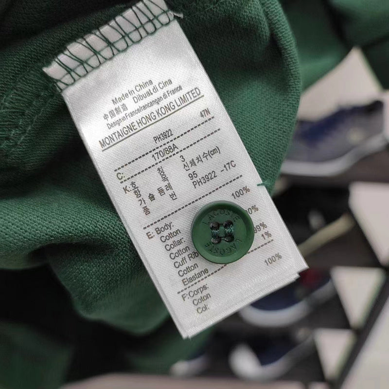 Side profile of Lacoste luxury clothing with signature branding