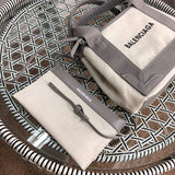 Styled lifestyle shot of signature polished women's handbag – women's luxury handbag