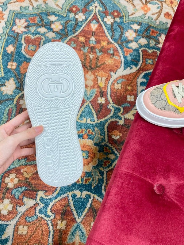 Side profile of Gucci crisp white sneakers retro runner design
