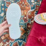 Side profile of Gucci crisp white sneakers retro runner design