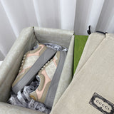 Side profile of Gucci soft grey sneakers classic court silhouette
