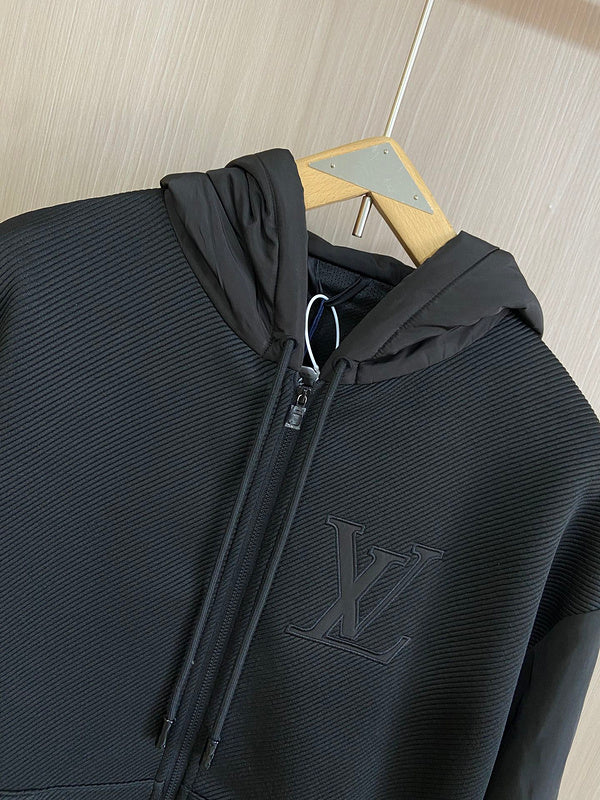 Close-up detail shot of Louis Vuitton luxury clothing with everyday silhouette