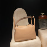 Side view of tailored structured handbag