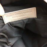 Side profile of polished statement women's handbag – women's statement bag