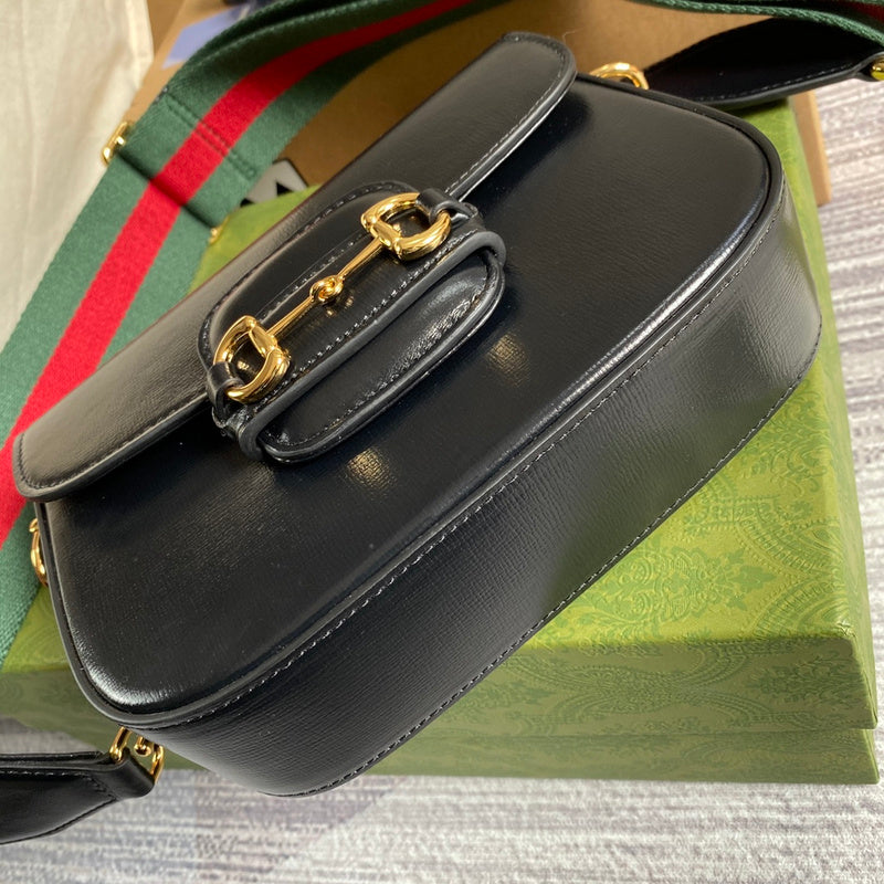 Side profile of structured signature women's handbag – women's luxury accessory