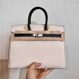Side view of modern structured handbag