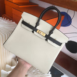 Side view of fluid structured handbag