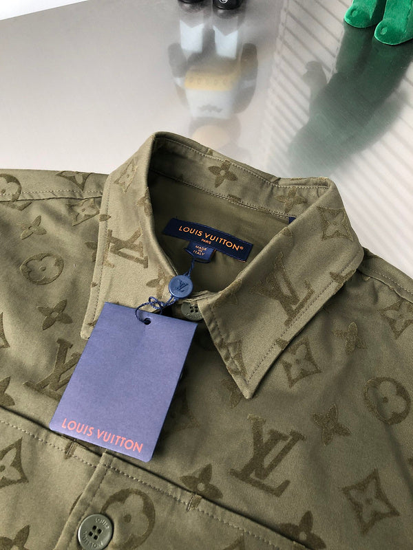 Close-up detail shot of Louis Vuitton luxury clothing with signature branding