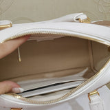 Handle and strap detail of polished structured women's handbag – women's everyday handbag