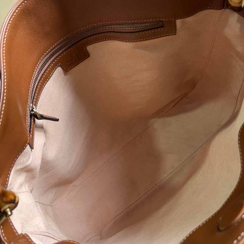 Side profile of structured everyday-luxe women's handbag – women's luxury accessory