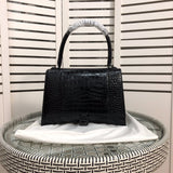 Side profile of sleek classic women's handbag – women's everyday handbag