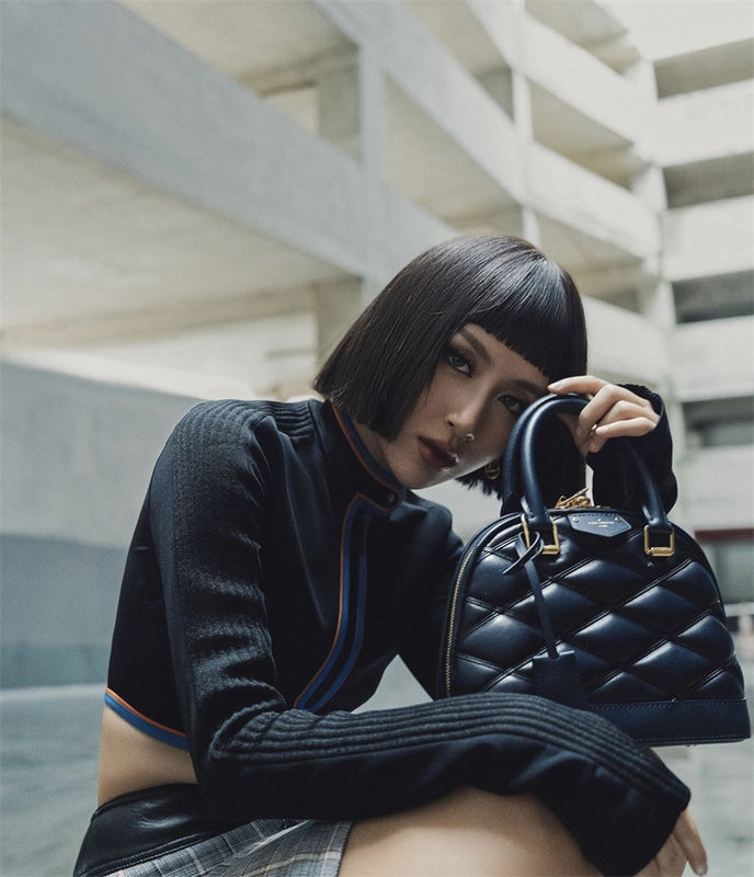 Sleek structured bag carried on shoulder 34