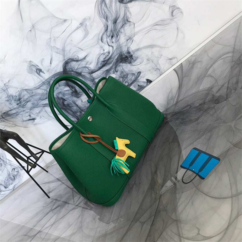 Side view of sleek structured handbag