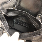 Side profile of elevated classic women's handbag – women's designer-style accessory