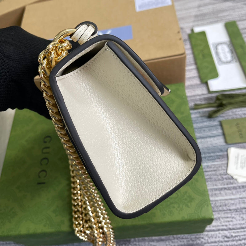 Handle and strap detail of statement polished women's handbag – women's everyday handbag