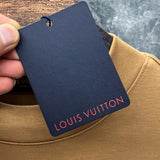 Close-up detail shot of Louis Vuitton luxury clothing with streetwear-inspired cut