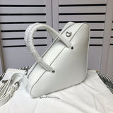 Front view of chic polished women's handbag – women's designer-style accessory
