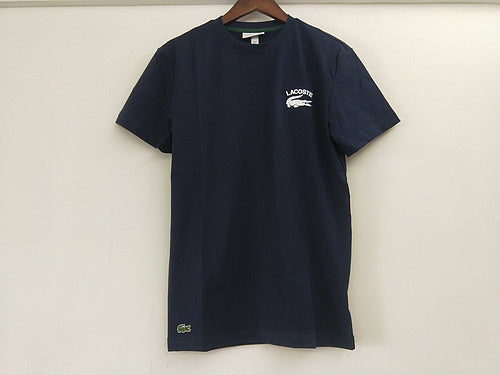 Close-up detail shot of Lacoste luxury clothing with signature branding